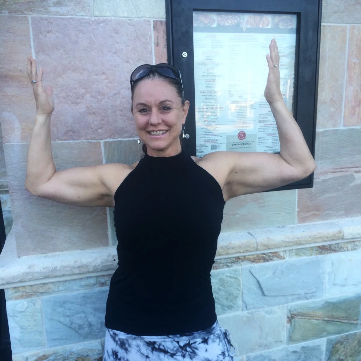 jandJ client showing off her strength after training